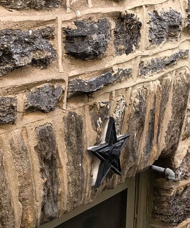 star-bolt-stone-wall